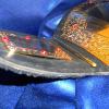 embossed leather strap that is flexible but strong enough to support the heavy plates