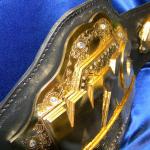 WXC custom championship title belt for mma with triple stacked plates of gold
extremely heavy custom championship title belt and great details