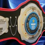 Guinness world records custom championship title belt designed and made by proambelts to honor the most consecutive kicks to one's forehead and this dual stacked metal belt is a sure way to recognized a world recorder holder!