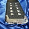 custom championship title belt end tip that is metal and has a vintage ProAmBelts logo etched into the metal championship belt tip